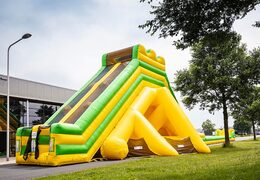 Super grote opblaasbare glijbaan van 46 meter lang kopen in het geel met groen
