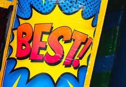 Kup zamek dmuchany A-frame Super Comic z projektem komiksowych pasków, idealny dla wynajmujących  Als je nog verde